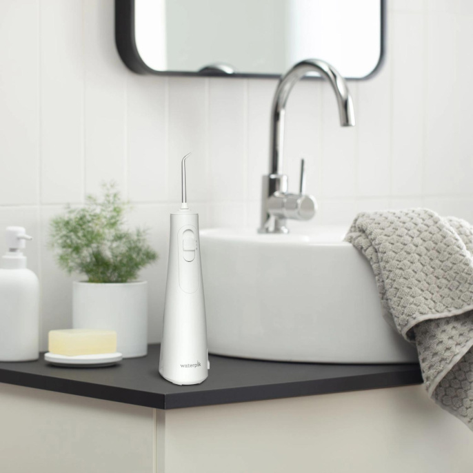 Ирригатор Waterpik WF-21 портатив. импульсн. 2насад. белый